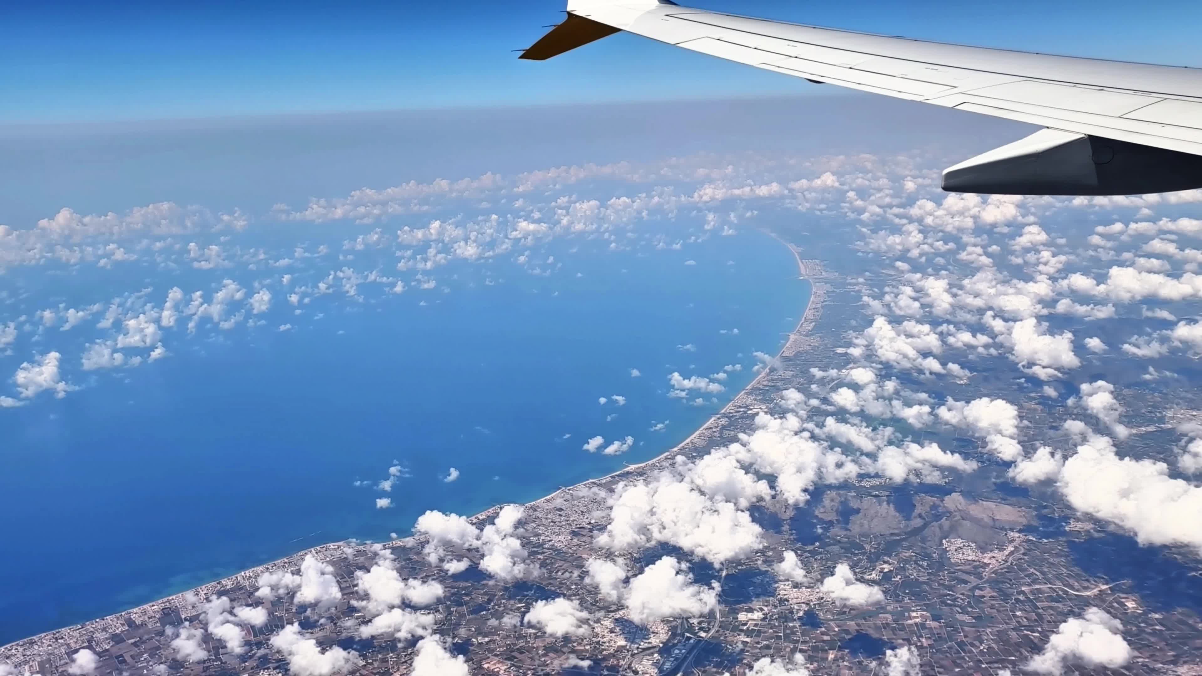 View from an airplane window over the coast